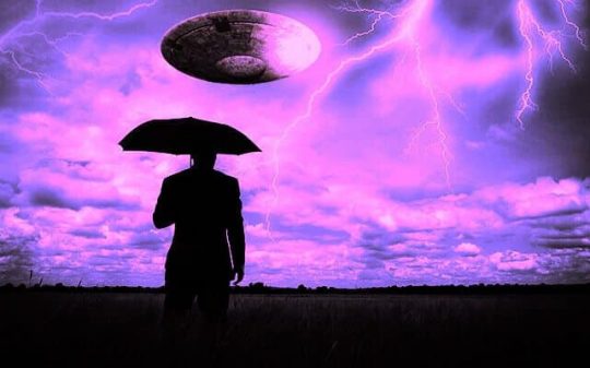 ufo in lighting storm flying over man