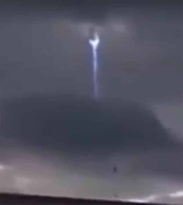 ufo spaceship behind clouds